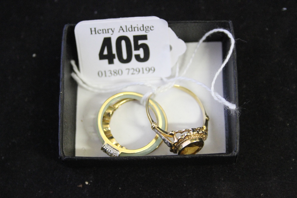 Hallmarked Gold: 9ct. Rings single amber coloured stone white and gold open shoulder, a cross over