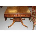 George IV mahogany sofa table, circa 1825, the figured top with rounded rectangular leaves and a