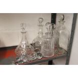 Glassware: 19th/20th cent. Cut glass decanters of various forms (5) with spare stoppers. (5).