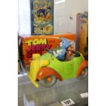 Toys: Lincoln International Tom & Jerry car with magic action - boxed plus a Happy Days tin money