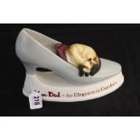 Advertising: Van-Dal ceramic shoe with cat sleeping on the front, produced by Wenham Pottery.