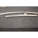 Edged Weapons: 19th cent. Burmese Dha steel blade, white metal hand grip and scabbard in traditional