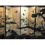 A superb 20th cent. Liberty and Co eight panel screen, black lacquer with gilt ground depicting a