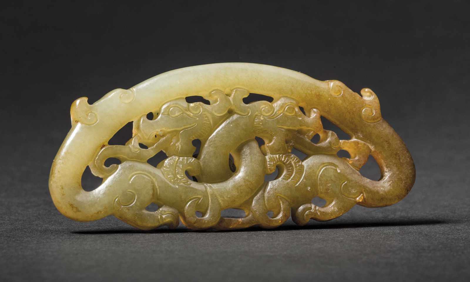 A Jade Huang Openwork with Dragon Design, Han Dynasty 漢代透雕龍紋玉璜 Width 8.2 cm, height 3.6 cm. 寬 8.2