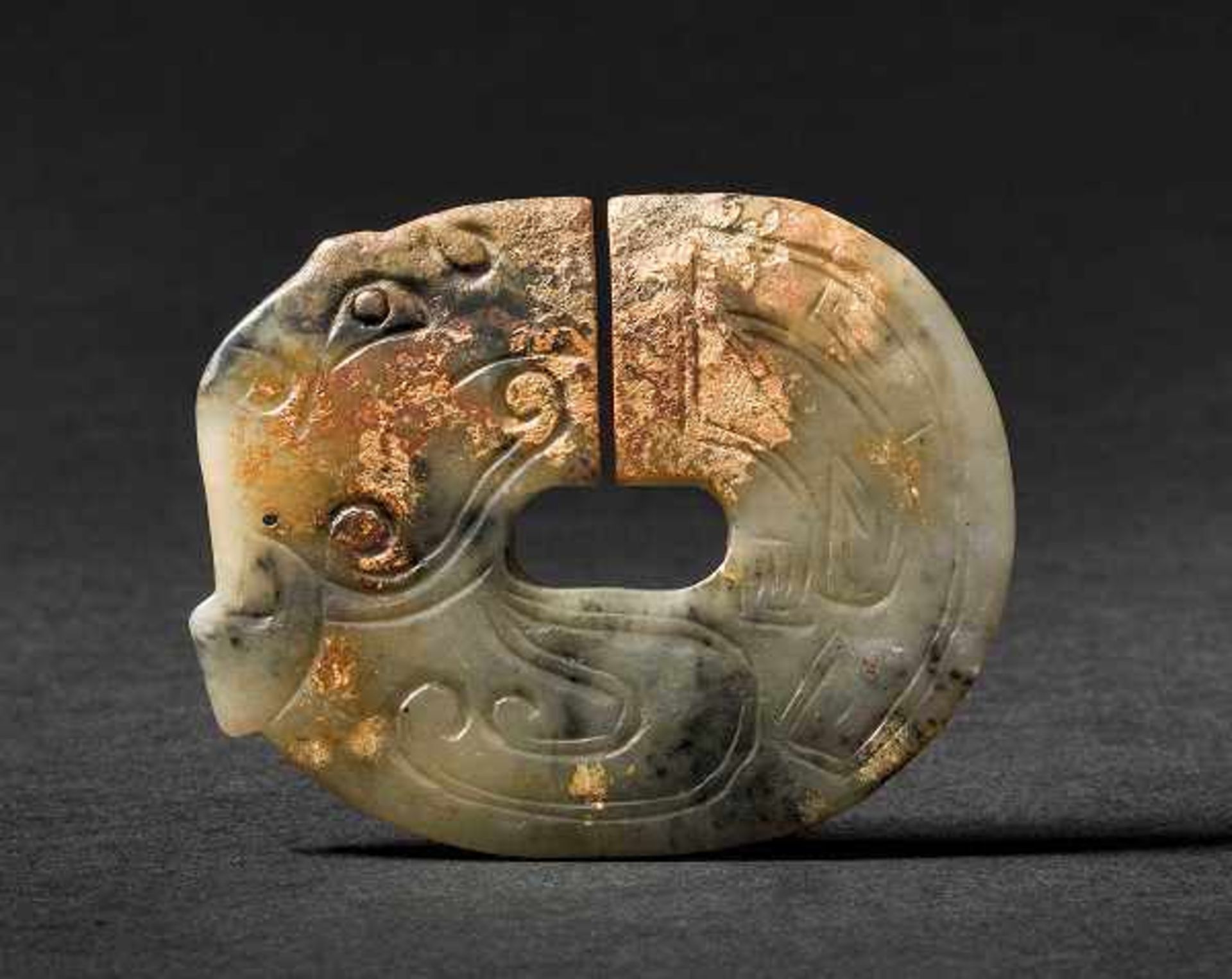 A Jade Jüe with Phoenix Design, Early Zhou Dynasty 西周早期鳳紋玉玦 Width 7.8 cm, height 6.3 cm. 寬 7.8 cm, 高