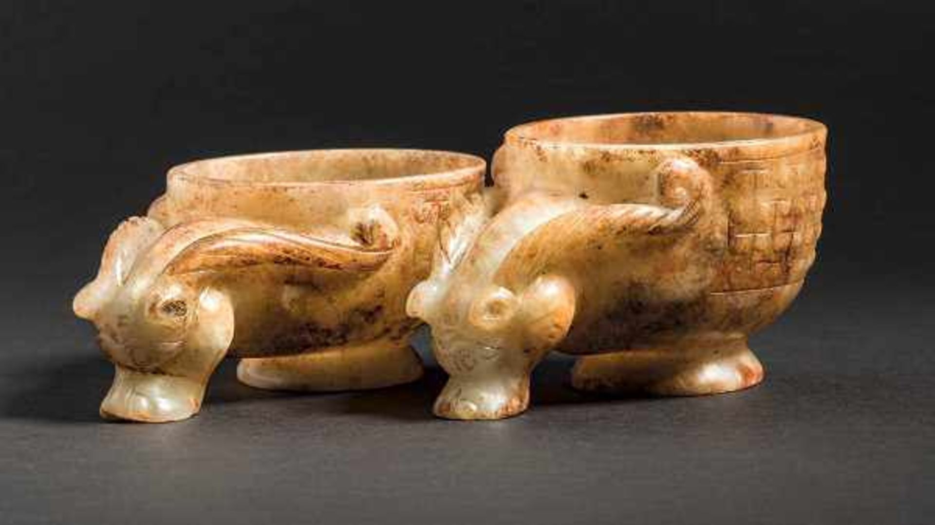 A Pair of Jade Cups in Beast Head Motif with Fine Carved Scolls, Warring States Period 戰國獸首勾雲紋玉杯（一對）