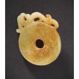 A Chukuo Jade Bi-disc with Phoenix Design, Western Zhou Dynasty 西周單鳳紋出廓玉璧 Diameter 6.3 cm. 直徑 6.3