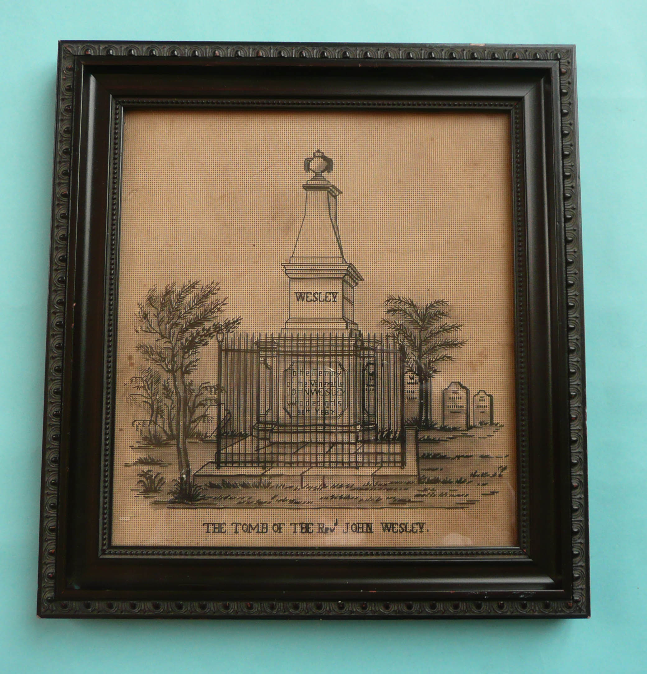 John Wesley: a black needlework on a pierced matrix depicting his tomb, framed 280 x 260mm (