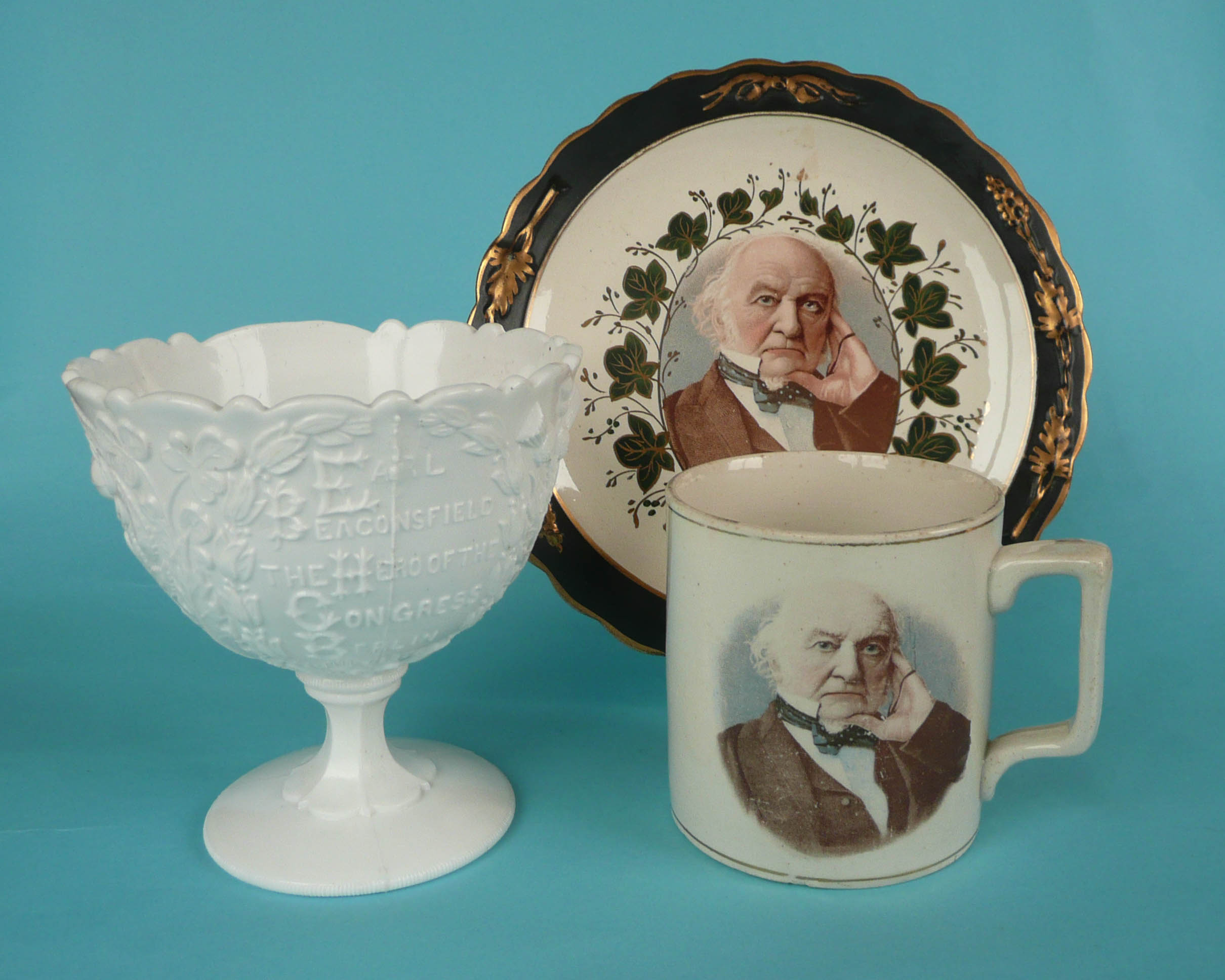 A moulded white glass bowl on foot for 1878 Congress of Berlin and a pottery mug and plate for