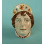 Queen Caroline: a colourful pearlware furniture rest modelled as a likeness of Caroline, circa 1820,