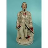 Admiral Napier: a small Staffordshire pottery figure depicted standing, circa 1860, 160mm (