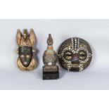 Zwei Yoruba Masken und eine Yoruba Figur, 3. V. 20. Jh., Holz, geschnitzt, braun und schwarz