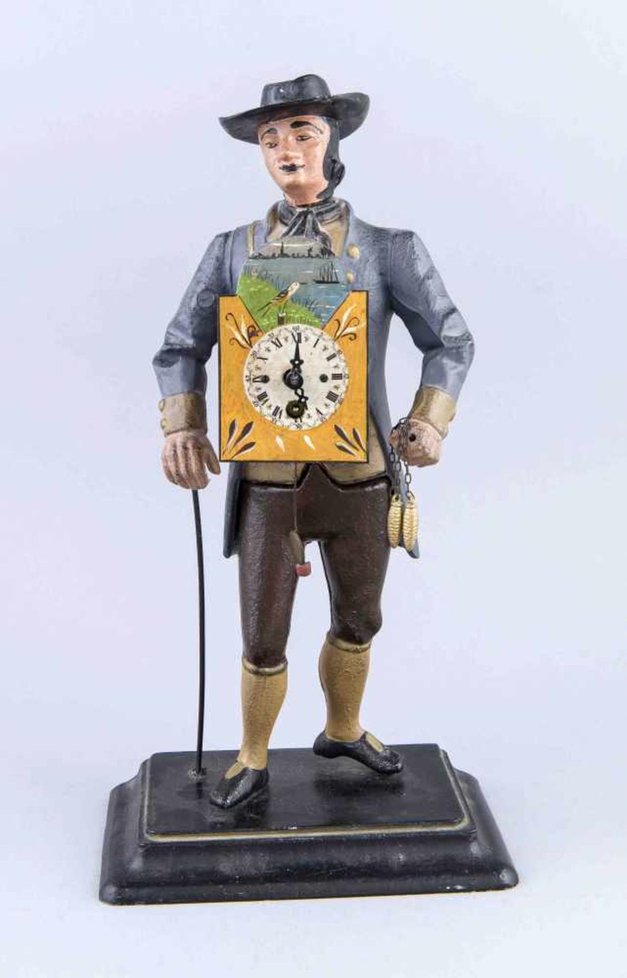 Sogen. Uhrenmann, Mitte 20. Jh., Metallguss farbig staffiert, Darstellung eines Mannes das Uhrwerk