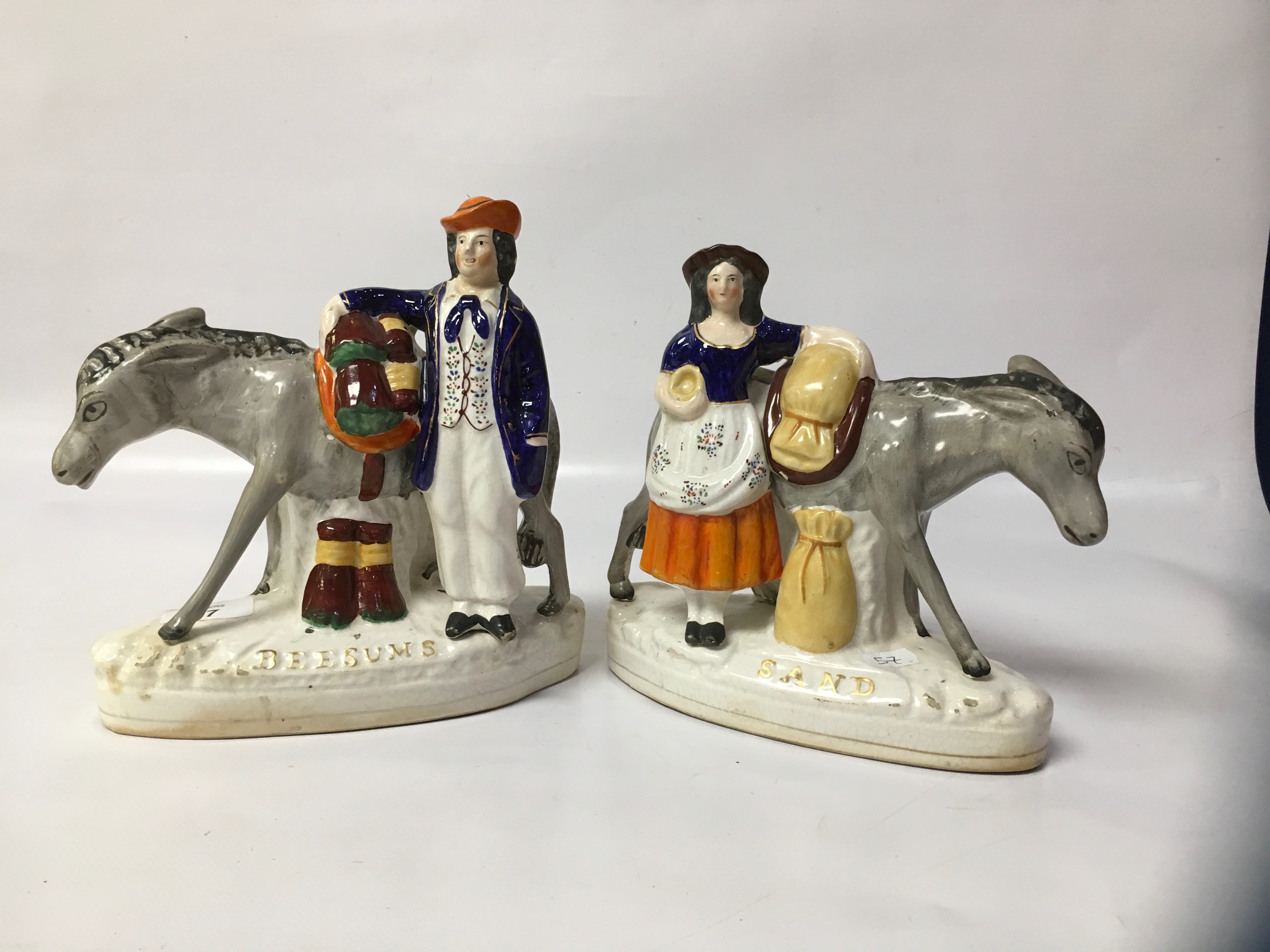 PAIR OF STAFFORDSHIRE MAN AND WOMAN WITH DONKEY,