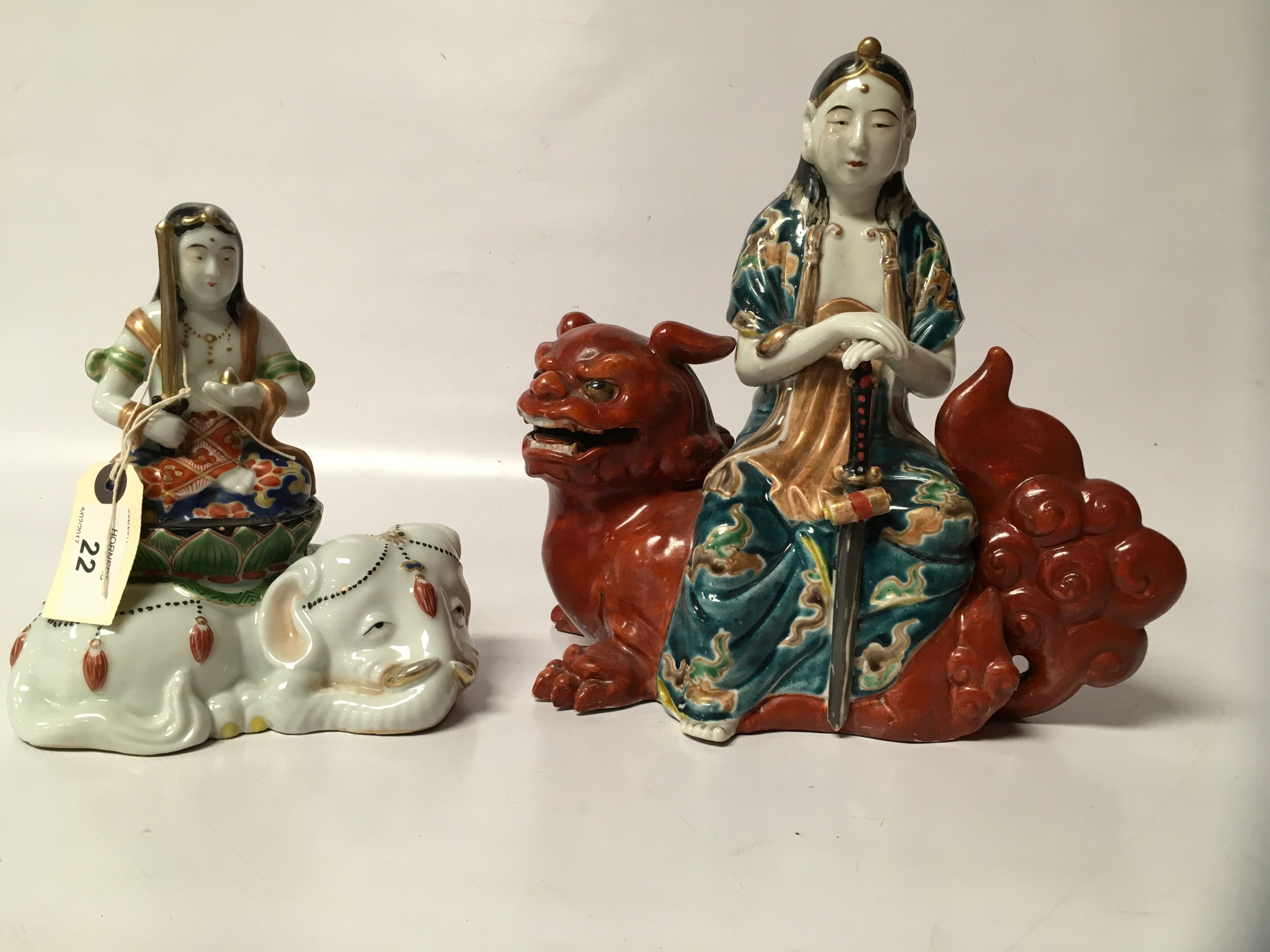 TWO KUTANI FIGURES - MEIJI FIGURE - GHANYIN ON FOO DOG AND 25CM AND GHANYIN SEATED ON ELEPHANT,