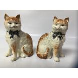 PAIR OF STAFFORDSHIRE CATS WITH BOWS