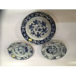 PAIR QIANLONG BLUE AND WHITE PLATES DECORATED WITH BAMBOO AND FLOWERS (ONE CHIPPED) ALONG WITH BLUE