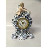 A LATE 19TH CENTURY CONTINENTAL BLUE AND WHITE CASED MANTLE CLOCK,