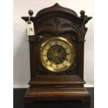 OAK CASED MANTLE CLOCK WITH ARTS AND CRAFTS STYLE DECORATION TO CASE AND DIAL,