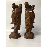 TWO LARGE CARVED WOODEN ORIENTAL FIGURES,