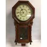 AN AMERICAN WALNUT WALL CLOCK,