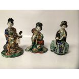 THREE MEIJI PERIOD KUTANI FEMALE FIGURES, ONE WITH SCROLL, ONE WITH DRUMS, THE OTHER WITH SCREEN,