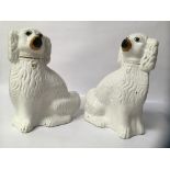 PAIR OF LARGE STAFFORDSHIRE WHITE SPANIEL DOG FIGURES,