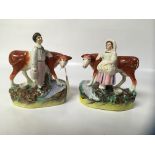 TWO STAFFORDSHIRE FIGURES WITH DAIRY COWS, MILK MAID AND BOY,