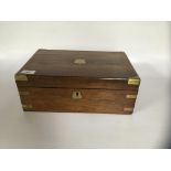 A ROSEWOOD FITTED WRITING SLOPE WITH BRASS SHIELD CARTOUCHE,