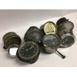 FIVE VINTAGE CAR CLOCKS AND A SPEEDOMETER