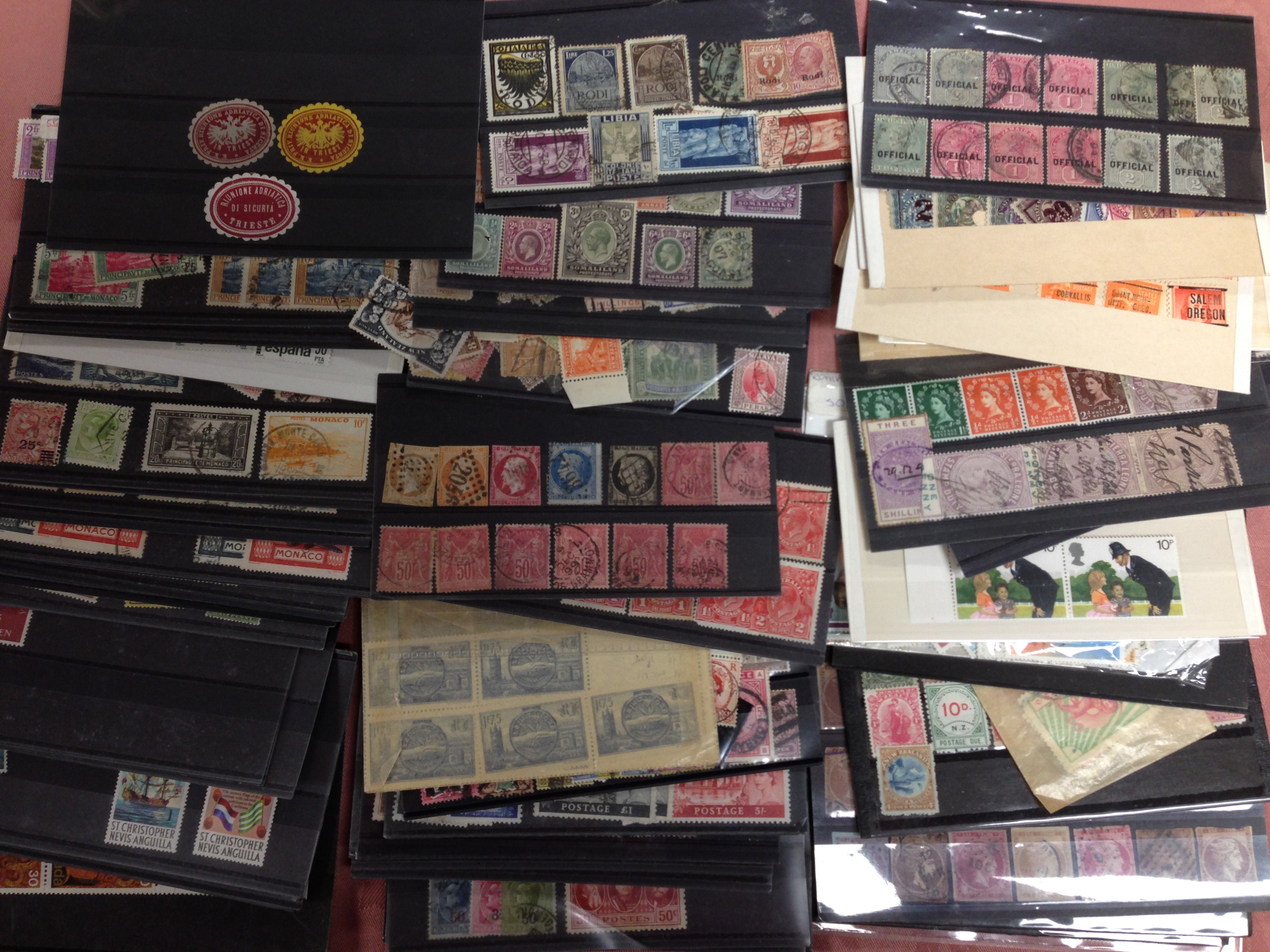 SMALL BOX OF ALL WORLD ON STOCKCARDS AND IN PACKETS, GB, NZ, MONACO, SWISS, NYASALAND, ETC.