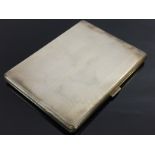 A SILVER CIGARETTE CASE,