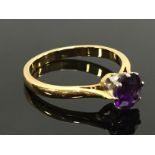 AN UNMARKED AMETHYST RING