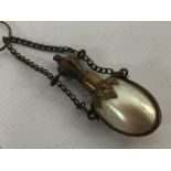 A FRENCH MOTHER OF PEARL SCENT BOTTLE ON CHAIN.