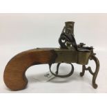 AN ANTIQUE FLINTLOCK PISTOL TINDER LIGHTER