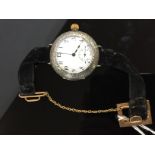 A SILVER POCKET WATCH CONVERTED TO A WRIST WATCH WITH SUBSIDIARY SECONDS ON A VELVET BRACELET WITH