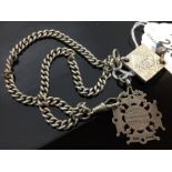 A SILVER CHAIN WITH PENDANT, WHITE METAL COIN WITH ARABIC INSCRIPTION,