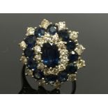 A SAPPHIRE & DIAMOND CLUSTER RING