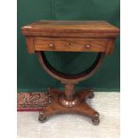 A LATE REGENCY ROSEWOOD FOLD OVER TOP GAMES TABLE WITH CHEQUER BOARD DETAIL ON HORSESHOE SHAPED