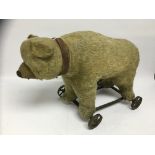 VINTAGE PULL-A-LONG TROLLEY STRAW FILLED BEAR,