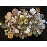 A LARGE COLLECTION OF ASSORTED WRIST AND POCKET WATCH MOVEMENTS FOR SPARES OR REPAIRS.