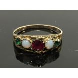 AN ANTIQUE RING SET WITH A CENTRAL GARNET,