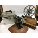 VINTAGE FILM SPLICER ON HAND DRIVEN REEL ROTATION STAND, HOME MADE PROJECTOR, METAL FLIGHT CASE,