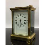 BRASS CARRIAGE CLOCK WITH ENAMELLED FACE COMPLETE WITH KEY