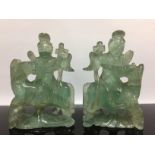 A PAIR OF C20TH CHINESE GREEN QUARTZ FIGURES ON HORSES.