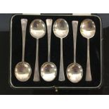 A CASED SET OF SIX SILVER ART DECO TEASPOONS,