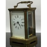 A BRASS CARRIAGE CLOCK WITH KEY