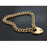 A 15 CT GOLD BRACELET WITH LOCK SHAPED CLASP