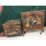 A BRASS LOG BOX WITH EMBOSSED DESIGN FIGURES ALONG WITH A MATCHING FIRE SCREEN