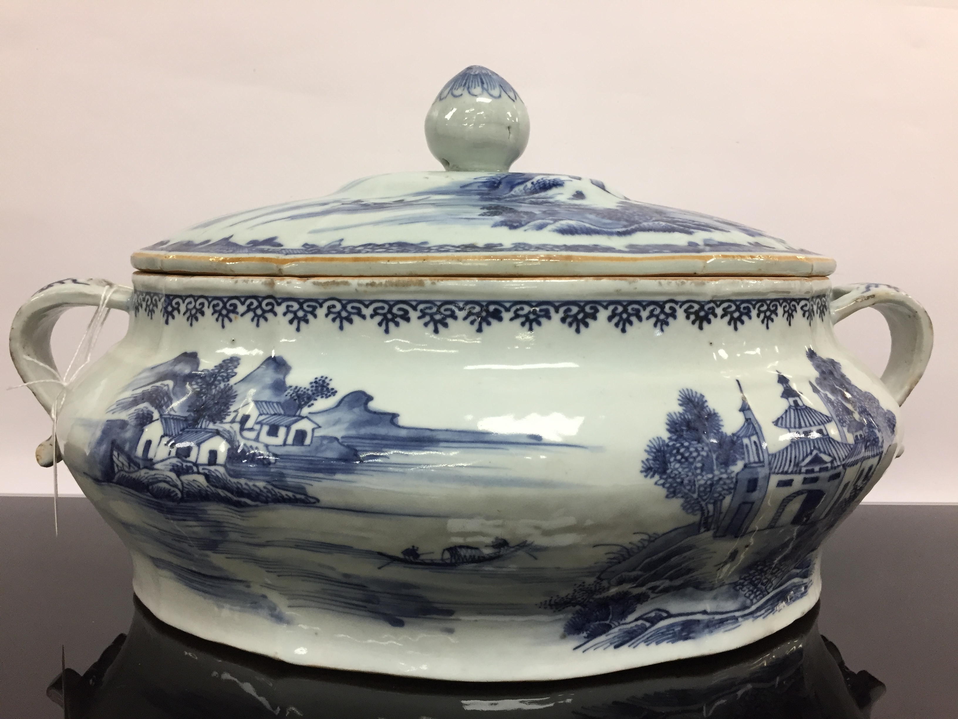 A CHINESE QUINLONG TWO HANDLED COVERED TUREEN AND A RELATED STAND,